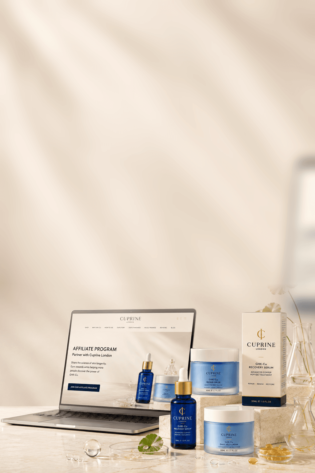 Cuprine affiliate programme on a laptop beside GHK-Cu products